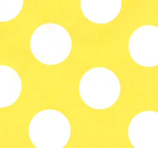 Žuta tkanina s bijelim krugovima.